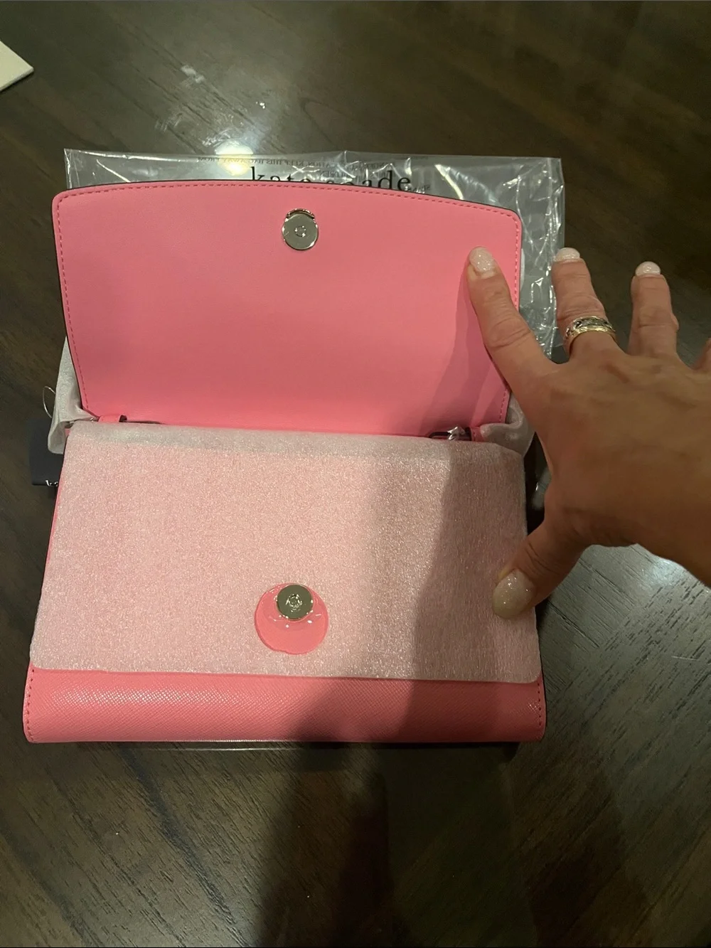 kate spade pink crossbody bag with gold logo